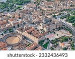 aerial view from a hot air balloon of the old Hospital of Tavera and the bullring of Toledo Spain and its surroundings