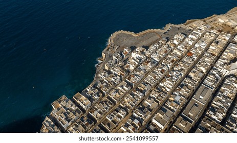 Aerial view of houses, apartments and buildings located in Polignano a Mare, in the province of Bari, Puglia, Italy. It is the most modern part of the town. - Powered by Shutterstock