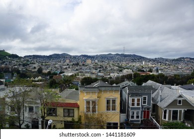 Aerial view of Houses, Cars. Cityscape, streets, and mountians of San Francisco in Potrero Hill Neighborhood with power-lines and cars parked on street.