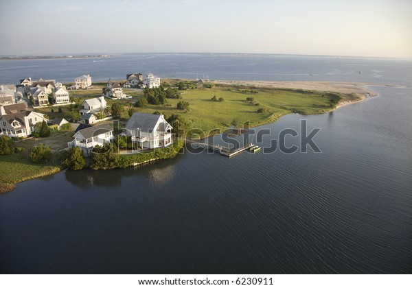 Aerial view of houses and ocean at Bald Head\
Island, North Carolina.