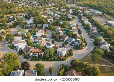 Aerial view of houses and streets in beautiful residential neighbourhood in Montreal, Quebec, Canada, North America. Property, homes and real estate concept, summer season.