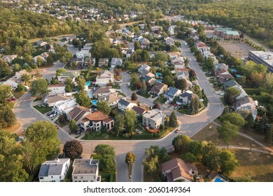 Aerial view of houses and streets in beautiful residential neighbourhood in Montreal, Quebec, Canada, North America. Property, homes and real estate concept, summer season. - Shutterstock ID 2060149364