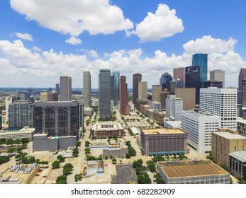 Aerial view Houston downtown against cloud blue sky with empty parking lot at weekends and background of skyscrapers/high-rises in the business district area. Architecture and travel background - Shutterstock ID 682282909