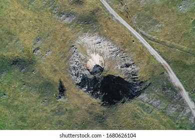 Aerial View Of A Huge Chasm In The Mountains, A Typical Karst Phenomenon