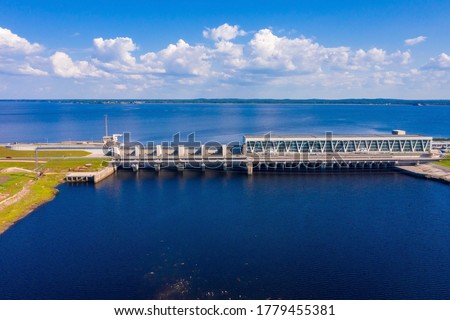 Aerial view of the huge dam in Latvia near city of Salaspils and Riga. A huge reservoir of water and river Daugava.