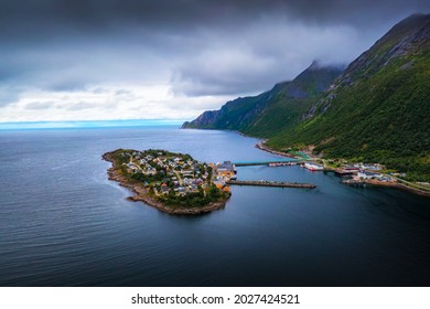 Aerial view of the Husoy fishing village on the Senja Island, northern Norway. The village covers the entire island of Husoy which is located in the Oyfjorden at the northwest coast of Senja.
