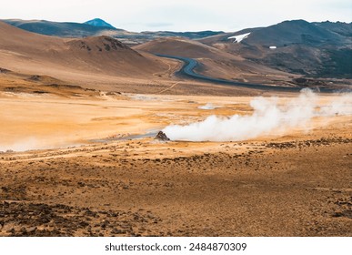 Aerial view of Hverir Geothermal Area in Iceland, capturing boiling mud pools, fumaroles, and the dramatic landscape of this geothermal hotspot near Lake Mývatn. - Powered by Shutterstock