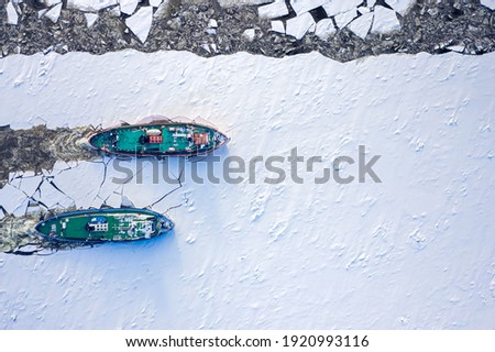 Aerial view of icebreakers crushes the ice on Vistula river, Poland, 2020-02-18