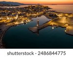 Aerial view  of the iconic old harbor of Rethymno with the amazing lighthouse  and the  venetian  architecture  in Crete, Greece.