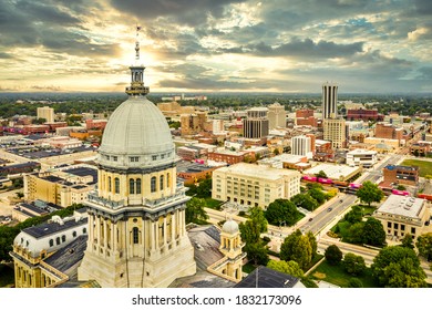 Aerial view of the Illinois State Capitol dome and Springfield skyline under a dramatic sunset. Springfield is the capital of the U.S. state of Illinois and the county seat of Sangamon County
