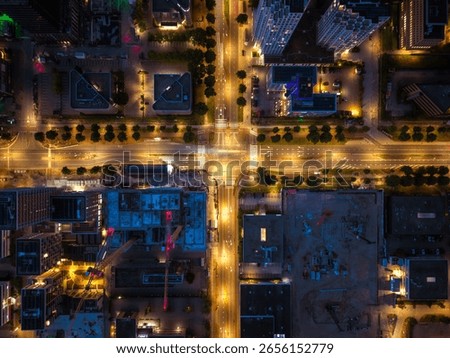 Aerial View of Illuminated Intersection and Construction Site at Night in Amsterdam South