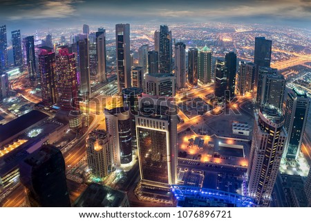 Aerial view to the iluminated city center of Doha, Qatar during evening time Imagine de stoc © 