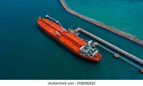 Aerial view industrial crude oil and fuel tanker ship at deep ocean sea port, Tanker ship vessel at terminal port, Business import export oil and gas petrochemical by tanker ship transportation oil.