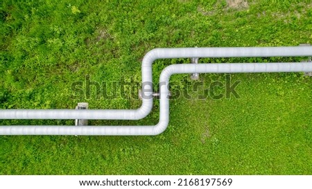 Aerial view of an industrial pipeline. Transportation of gaseous and liquid substances. Aboveground pipeline view from a height. The place of bending of the pipeline