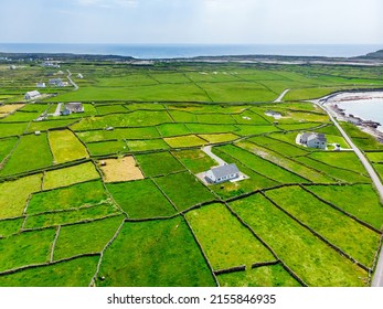 Aerial View Of Inishmore Or Inis Mor, The Largest Of The Aran Islands In Galway Bay, Ireland. Famous For Its Strong Irish Culture, Loyalty To The Irish Language, And A Wealth Of Ancient Sites.