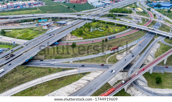 Aerial\
view interchange express way and a trafific\
jam