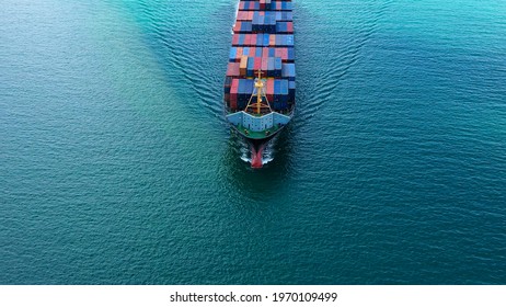 Aerial view of international containers cargo ship at industrial import-export port transport goods around world, global transportation and logistic business.Oversea international Business.