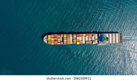 Aerial view of international containers cargo ship at industrial import-export port transport goods around world, global transportation and logistic business.Oversea international Business.