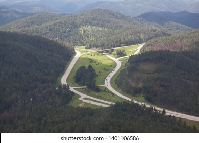 An aerial view of the intersection and bridge where highway 16 and highway 16a meet in South Dakota's Black Hills.