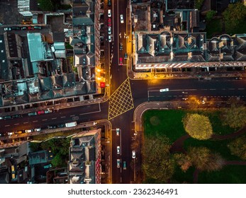 
aerial view of an intersection with some traffic in Dublin city centre during evening time. Ireland