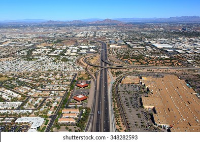 Aerial view of Interstate 10 and U.S. Route 60 (Superstition Freeway) interchange looking north along the border of Tempe and Phoenix, Arizona