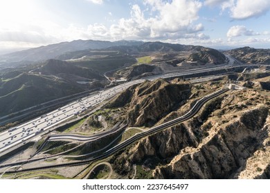 Aerial view of the Interstate 5 freeway and Los Angeles aqueduct cascades near Newhall and Santa Clarita in Southern California.   - Shutterstock ID 2237645497