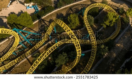 Aerial view of the iron structures of a roller coaster.