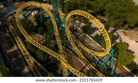 Aerial view of the iron structures of a roller coaster.