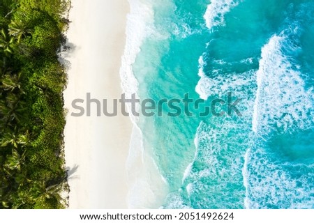 Aerial view of the island's beach and turquoise water. Seychelles, Indian Ocean