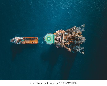 Aerial view of jack up rig with towing vessel during towing operation