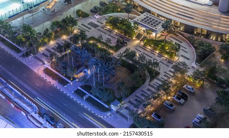 Aerial View Of JBR Street With Parking Lot With Cars Night Timelapse. Dubai Road And Intersections. Top View Or Overhead