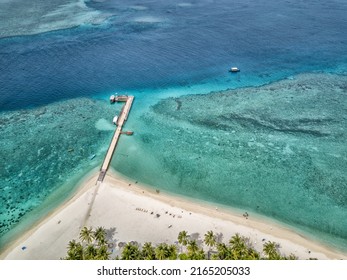 Aerial view of the jetty in an atoll in the Maldives