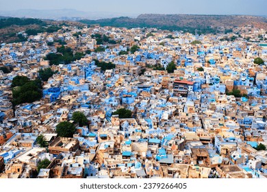 Aerial view of Jodhpur, also known as Blue City due to the vivid blue-painted Brahmin houses around Mehrangarh Fort. Jodphur, Rajasthan, India. Tilt shift miniature toy effect - Powered by Shutterstock