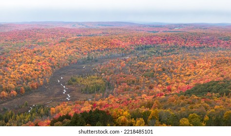 Aerial view of the Jordan Valley River from Dead Man's Hill on a cloudy autumn day with vibrant foliage colors. North. - Shutterstock ID 2218485101