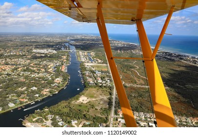 Aerial View Of Juno Beach, Florida, With The Intracoastal Waterway, The Donald Ross Drawbridge, And In The Distance The Juno Beach Fishing Pier.