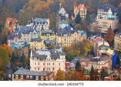 Aerial view of Karlovy Vary old town with beautiful traditional buildings in overcast day, Czech Republic