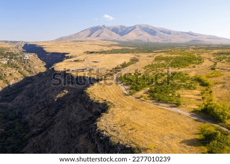 Aerial view of Kasakh river canyon and Mount Ara on sunny summer day. Aragatsotn Province, Armenia. 