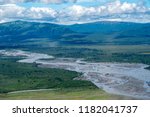 Aerial view of Katmai National Park. Braided river with sandbars, lush green mountains in backgrounds