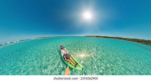 Aerial View Kayak In The Beach Reef Of Piana Island, Close To The Bonifacio Town In Corsica Of France. Drone View Of People Kayaking In The Mediterranean Sea By Piana Island.