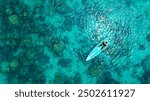 Aerial view of a kayak in the blue sea .Woman kayaking She does water sports activities.