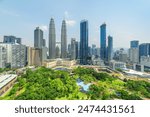 Aerial view of the KLCC Park in Kuala Lumpur, Malaysia. The urban park in Kuala Lumpur City Center is a popular tourist attraction of Asia. Awesome Kuala Lumpur skyline.