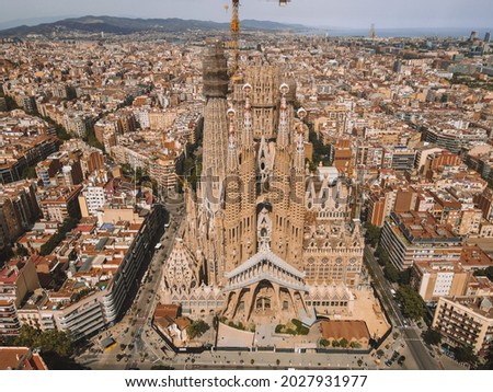 Aerial view of La Sagrada Familia in Barcelona, Antoni Gaudí's renowned unfinished church, in Catalonia, Spain. Drone photography of cathedral designed by Gaudi, Catalogna birds eye.