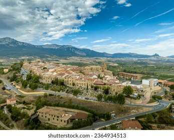Aerial view of Laguardia medieval walled hilltop town in Rioja Spain with cloudy blue sky - Shutterstock ID 2364934513