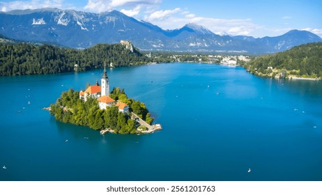 Aerial view of lake bled featuring the assumption of mary church on a small island, with kayakers enjoying summer in the julian alps - Powered by Shutterstock