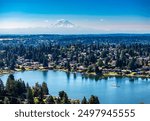 An aerial view of Lake Burien and Mount Rainier in Burien, Washington.