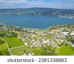 Aerial view of Lake Constance - Kreuzlingen - Konstanz - Steckborn on a sunny summer day. Green hills and blue lake between Switzerland and Germany