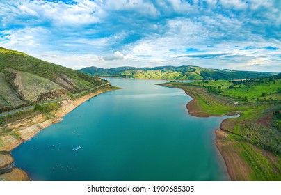 Aerial view at the Lake of Furnas at Capitólio - MG, Brazil. Beautiful landscape between mountains on a blue sky. Eco tourism destination of Minas Gerais state.