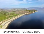 Aerial view of Lake Granby, Colorado and surrounding mountains and forests on calm sunny summer morning.