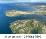 Aerial view of Lake Iliamna with islands, Aleutian mountain range and reflection. Near Pedro Bay, Alaska. 