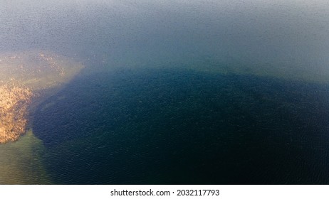 Aerial View Of The Lake Or River With Pattern Wave. Water Surface With Ripples Texture Background. Viewed From Above.